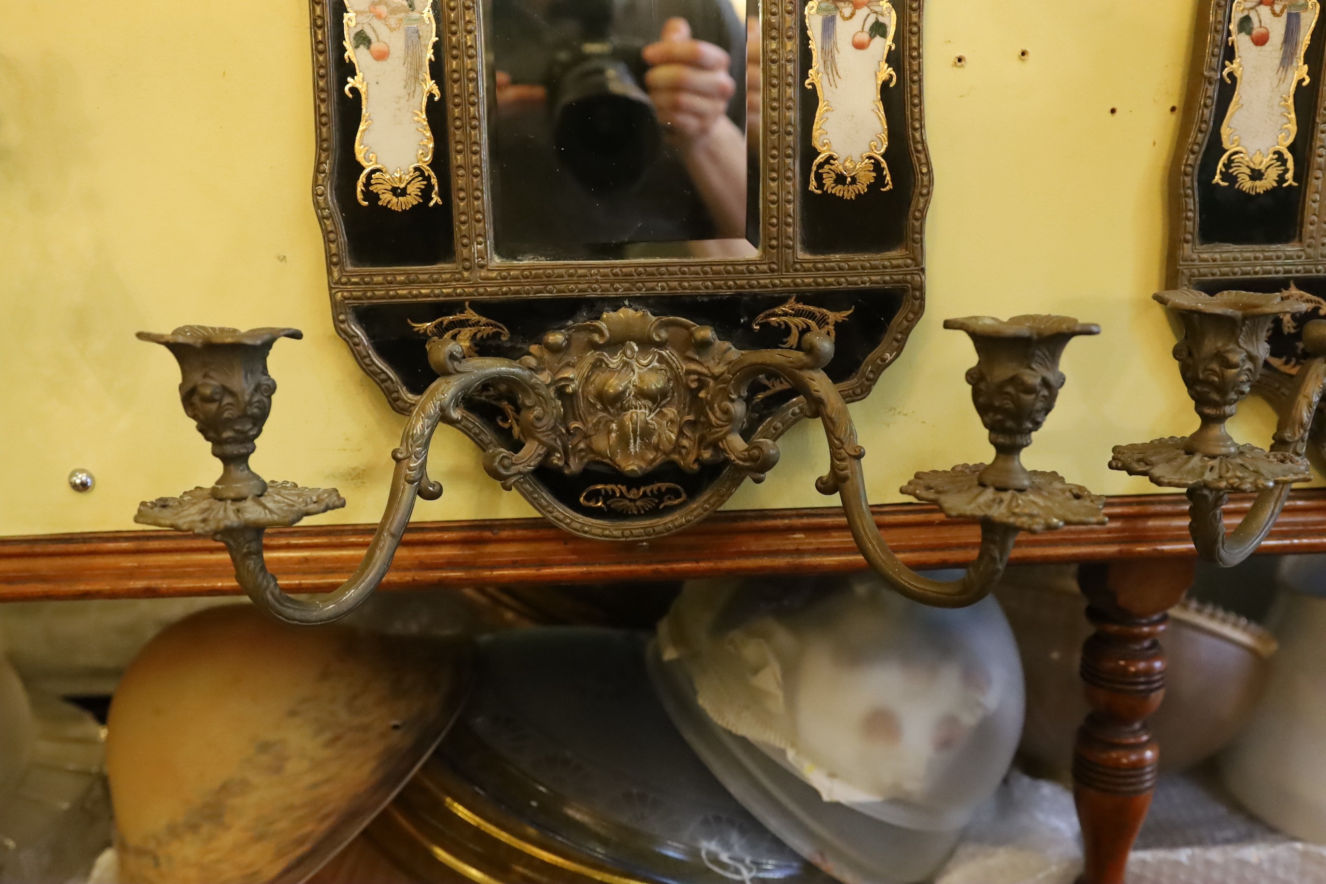 A pair of brass mounted ceramic girandoles in the Louis XIV style, height 64cm. width 38cm